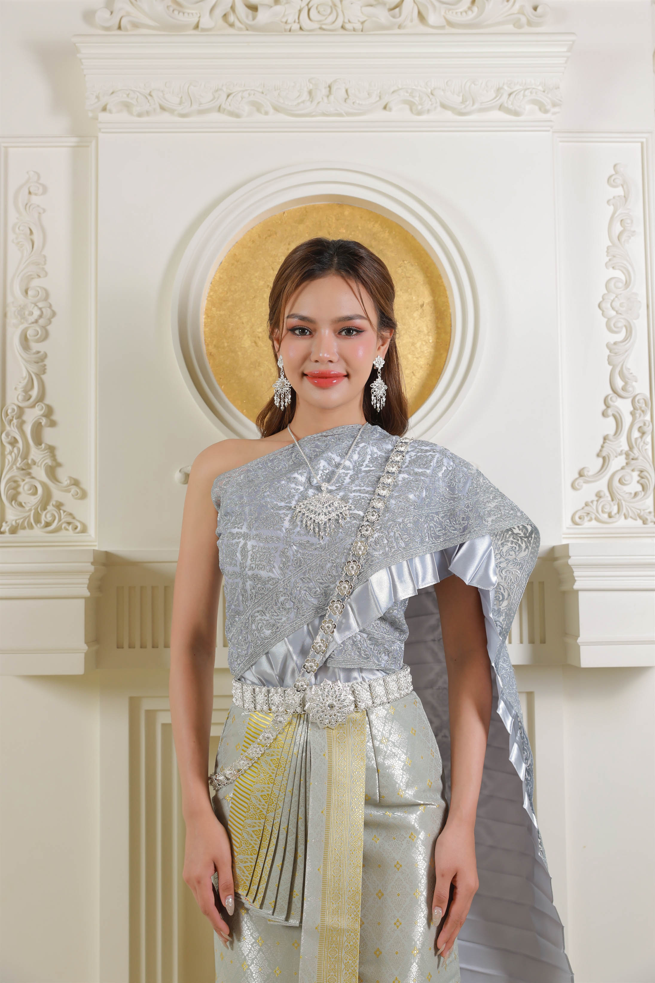 Thai woman wearing silver traditional Thai dress